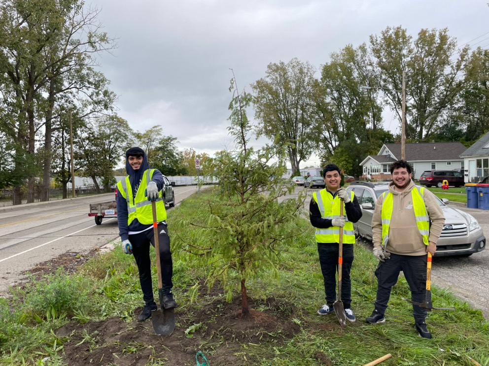 a few students excited to volunteer planting trees